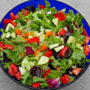 Green Salad is a refreshing dish with assorted fresh greens, cucumbers, tomatoes, and a light dressing.